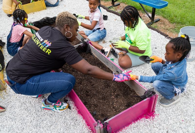 After the event, kids at the A.W. “Tony” Matthews Boys & Girls Club in Mableton planted strawberry beds and vegetables outside of the club.