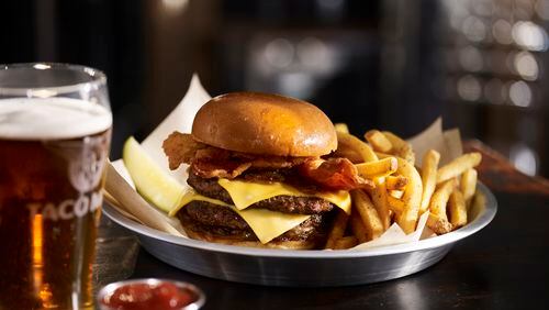 Head to Taco Mac for an original burger and beer for $9.95 or upgrade to this bacon burger for a buck. HANDOUT / Melissa Libby & Associates.