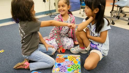 Students play games in English in a program for children learning English as their second language