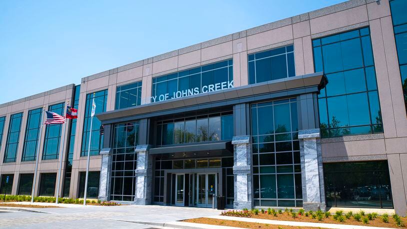 The Johns Creek property owner who wants to convert part of his small shopping center into apartments to help keep it open said his rezoning request was unfairly denied and he’s considering legal action against the city.
