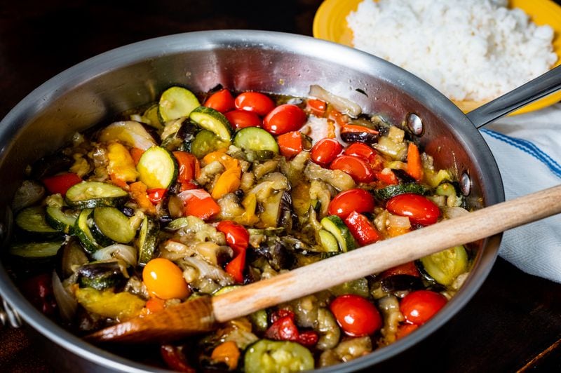 Speedy Ratatouille includes onion, eggplant, zucchini, red bell pepper and cherry tomatoes. Henri Hollis/For The AJC