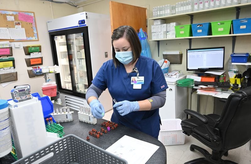 Lindsey Chambless, lab director, prepares testing kits. Testing and prevention help keep patients out of the ER and the hospital stay profitable, according to Chief Nursing Officer Shawn Whittaker. (Hyosub Shin / Hyosub.Shin@ajc.com)