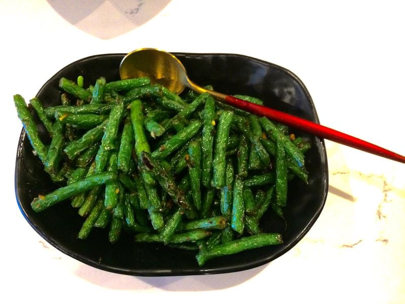 The wok-fried green beans at Gu’s Kitchen on Buford Highway are a good vegan option. CONTRIBUTED BY WENDELL BROCK