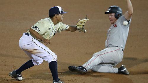 April 25, 2017, Atlanta: Georgia Tech infielder Austin Wilhite takes the throw catching Georgia’s Mitchell Webb stealing second for the out during the sixth inning in a NCAA college baseball game on Tuesday, April 25, 2017, at Russ Chandler Stadium in Atlanta. Curtis Compton/ccompton@ajc.com