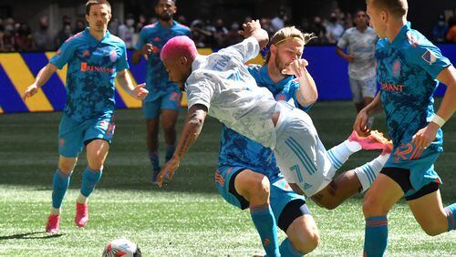 May 29, 2021 Atlanta - Atlanta United forward Josef Martinez (7) collides with Nashville SC defender Walker Zimmerman (25) as he works with the ball during the second half in a MLS soccer match at Mercedes-Benz Stadium in Atlanta on Saturday, May 29, 2021. The game ended with 2-2. (Hyosub Shin / Hyosub.Shin@ajc.com)
