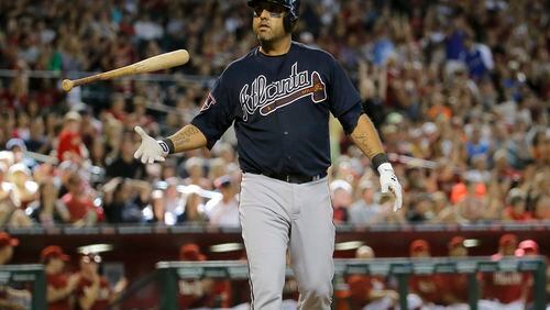 Atlanta Braves' Gerald Laird flips his bat after striking out with the bases loaded to end the eighth inning of a baseball against the Arizona Diamondbacks, Sunday, June 8, 2014, in Phoenix. (AP Photo/Matt York) After losing a weekend series to last-place Arizona, the Braves have dropped into a three-way tie for first place.