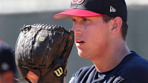 Feb 17, 2018 Lake Buena Vista: Braves pitcher Lucas Sims prepares to deliver a pitch working in the pen on Saturday, Feb 17, 2018, at the ESPN Wide World of Sports Complex in Lake Buena Vista.     Curtis Compton/ccompton@ajc.com