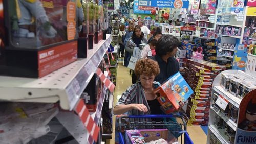 In this November 2016 file photo, the checkout area at the Kennesaw Toys R Us was a busy place during the early Black Friday (or Gray Thursday) sale.