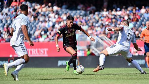 Atlanta United forward Luiz Araújo #19 dribbles the ball during the first half of the match against Chicago Fire FC at Soldier Field in Chicago, United States on Saturday July 30, 2022. (Photo by Dakota Williams/Atlanta United)
