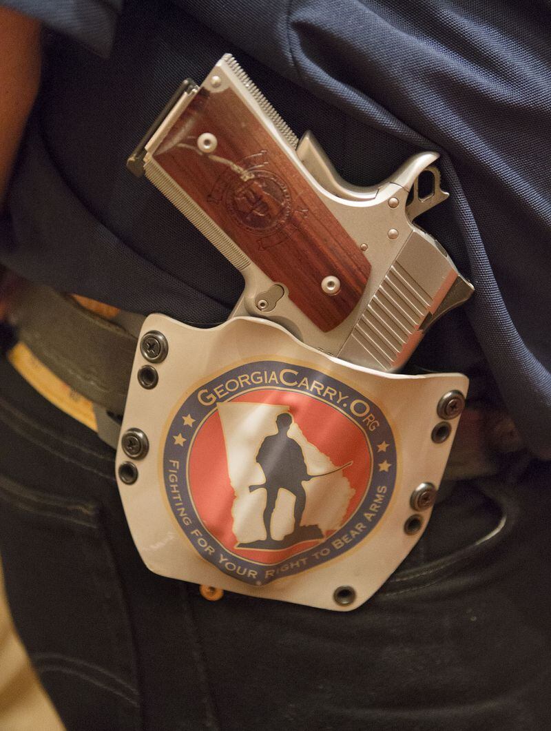 8/16/14-ATLANTA: Bruce Greenfield carried his gun in a custom holster during the 6th Annual GeorgiaCarry.org convention at the Renaissance Atlanta Waverly Hotel in Atlanta on Saturday August 16th, 2014. Second Amendment supporters celebrated Georgian's right to bear arms which has been expanded after the passage of HB60, a bill that gained international attention. (Photo by Phil Skinner / For the AJC) Gun owners lost an appeal to the Georgia Supreme Court today regarding guns in school zones. (AJC Photo)