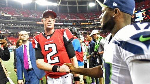 Falcons quarterback Matt Ryan (2) shakes hands with Seattle Seahawks wide receiver Devin Hester (17) after Atlanta Falcons won 36-20 during the NFC divisional playoffs at the Georgia Dome on Saturday, January 14, 2017. HYOSUB SHIN / HSHIN@AJC.COM