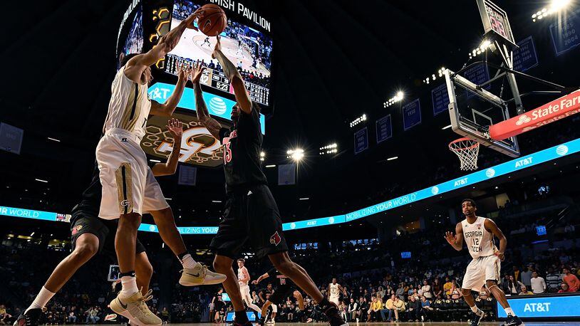 ATLANTA, GA - JANUARY 07: Josh Heath #11 of the Georgia Tech Yellow Jackets works to avoid a Louisville trap during the game at Hank McCamish Pavilion on January 7, 2017 in Atlanta, Georgia. (Photo by Mike Comer/Getty Images)
