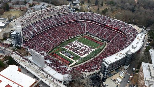 Fans fill Sanford stadium for the program.  The Georgia Bulldogs football team, the 2022 College Football Playoff National Championship winners between the Georgia Bulldogs and the Alabama Crimson Tide, celebrate with a parade in Athens, GA,  on Saturday, January 15, 2022.   Curtis Compton / Curtis.Compton@ajc.com