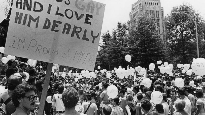 A marcher holds a sign in support of his father during a Gay Pride march and rally at the State Capitol in Atlanta on June 26, 1982. MANDATORY CREDIT: Photo credit: NANCY MANGIAFICO / THE ATLANTA JOURNAL-CONSTITUTION