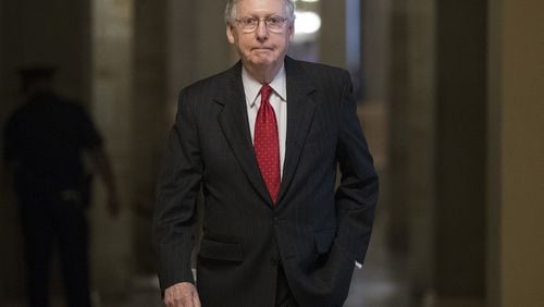 Senate Majority Leader Mitch McConnell of Ky. walks from his office to the Senate floor on Capitol Hill in Washington, Wednesday, July 26. It was the second day of debate on Senate Republicans’ effort to repeal Obamacare. A vote to repeal the individual mandate and other provisions failed 45-55 Wednesday. (AP Photo/Carolyn Kaster)
