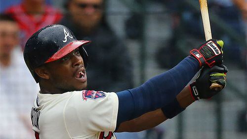 072014 ATLANTA: Braves Justin Upton hits a double against the Phillies during the second inning of an MLB game on Sunday, July 20, 2014, in Atlanta. CURTIS COMPTON / CCOMPTON@AJC.COM