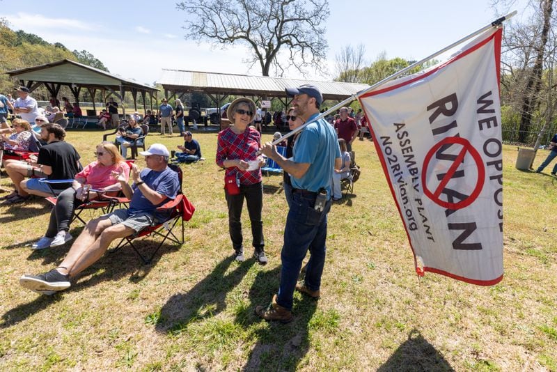 Alan Jenkins (Right) talks to friends at the Rivian Opposition Barbecue fundraiser in Rutledge Saturday, March 25, 2023.  (Steve Schaefer/steve.schaefer@ajc.com)