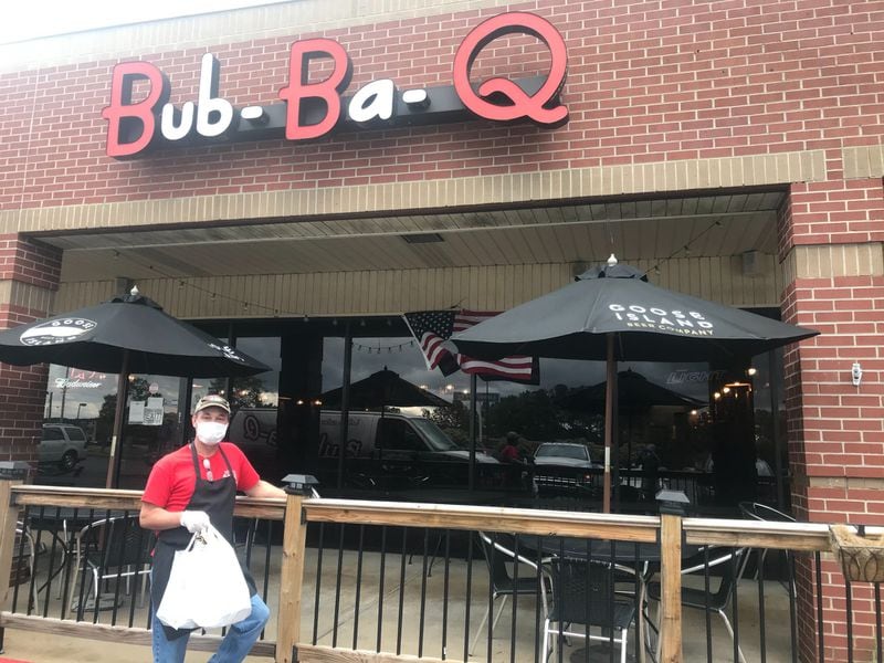 William “Bubba” Latimer is the owner and pitmaster at Bub-Ba-Q, with locations in Jasper and Woodstock. LIGAYA FIGUERAS/LIGAYA.FIGUERAS@AJC.COM