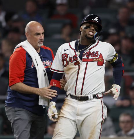 Atlanta Braves right fielder Ronald Acuna is hit by a Philadelphia Phillies pitch during the sixth inning of game two of the National League Division Series at Truist Park in Atlanta on Wednesday, October 12, 2022. (Jason Getz / Jason.Getz@ajc.com)