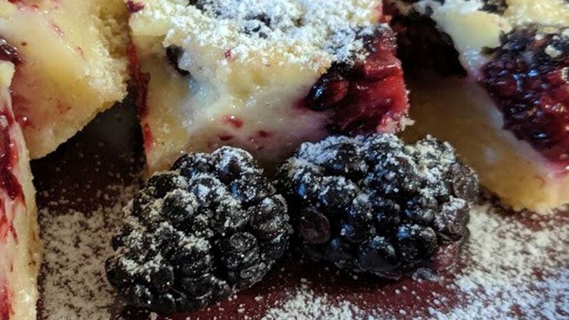 With Blackberry Custard Bars, one of the recipes in “Decadent Fruit Desserts” by Jackie Bruchez, the blackberries take center stage. PHOTO AND STYLING BY PAULA PONTES