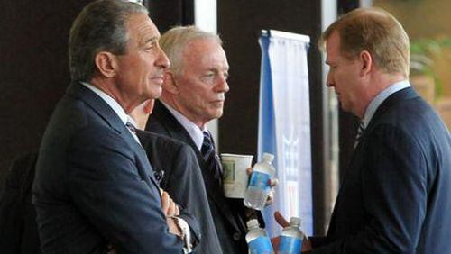 Atlanta Falcons owner Arthur Blank, from left, Dallas Cowboys owner Jerry Jones, and NFL Commissioner Roger Goodell have a conversation in the hallway outside the NFL Owners meetings at the Atlanta Airport Gateway Marriott in Atlanta on Thursday, July 21, 2011.