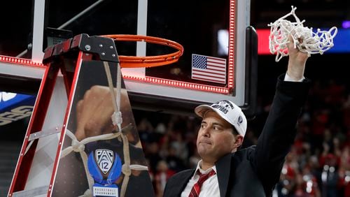 What scandal? Arizona coach Sean Miller waves the net after his team's Pac-12 tournament victory. (AP Photo/Isaac Brekken)