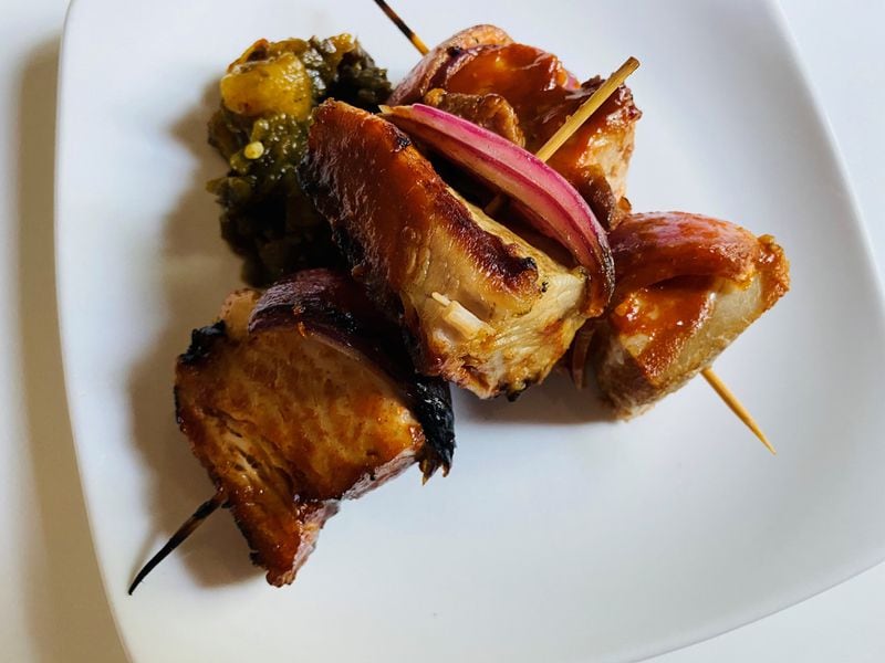 The pork belly skewers, served here with poblano and pina relish and furikake, are a popular menu item at Restaurant Holmes. CONTRIBUTED BY BOB TOWNSEND