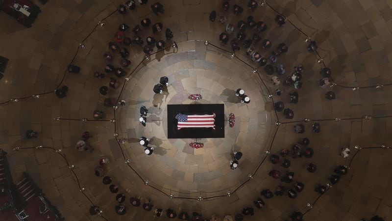 The flag-draped casket of the late former President George H.W. Bush as he lies in state in the Capitol Rotunda on December 5, 2018 in Washington, DC. A WWII combat veteran, Bush served as a member of Congress from Texas, ambassador to the United Nations, director of the CIA, vice president and 41st president of the United States. Bush will lie in state in the U.S. Capitol Rotunda until Wednesday morning.