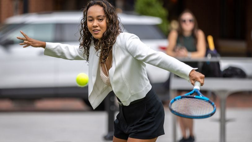 Canadian tennis player Leylah Fernandez volleys with the official Ball Kids before the start of the Atlanta Open Media Day on Tuesday at Atlantic Station. (Steve Schaefer / steve.schaefer@ajc.com)