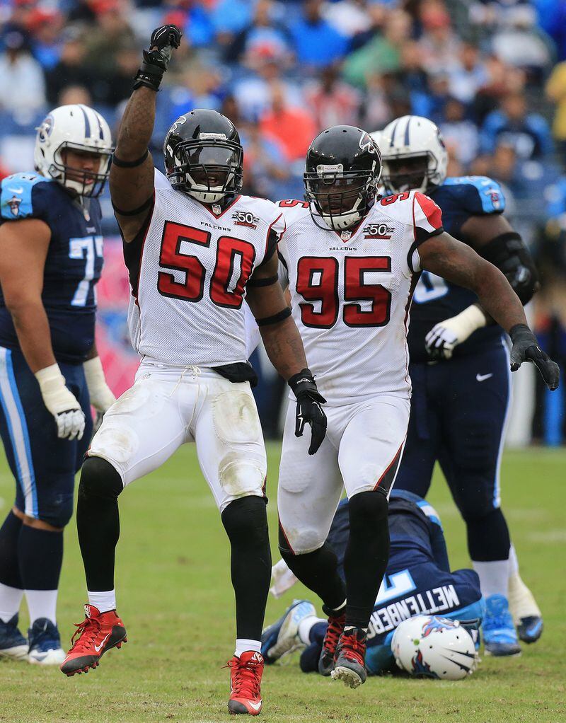 *** POSSIBLE POSTER *** 102515 NASHVILLE: —SACKED — Falcons linebacker O’Brien Schofield (left) celebrates sacking Titans quarterback Zach Mettenberger as Jonathan Babineaux arrives to join in the celebration during the third quarter in a football game on Sunday, Oct. 25, 2015, in Nashville. The Falcons beat the Titans 10-7. Curtis Compton / ccompton@ajc.com