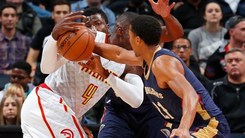 ATLANTA, GA - NOVEMBER 22: Solomon Hill #44 of the New Orleans Pelicans defends as Anthony Brown #21 steals the ball from Paul Millsap #4 of the Atlanta Hawks at Philips Arena on November 22, 2016 in Atlanta, Georgia. NOTE TO USER User expressly acknowledges and agrees that, by downloading and or using this photograph, user is consenting to the terms and conditions of the Getty Images License Agreement. (Photo by Kevin C. Cox/Getty Images)