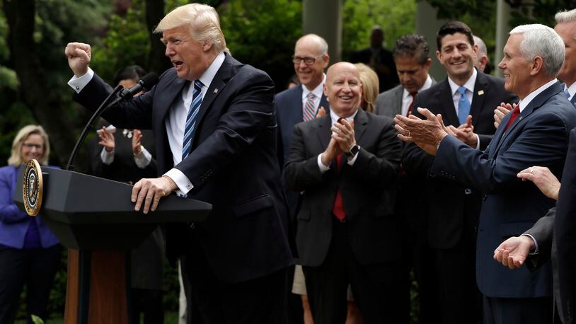 President Donald Trump gestures as he speaks in the Rose Garden of the White House in Washington, Thursday, May 4, 2017, after the House pushed through a health care bill. (AP Photo/Evan Vucci)