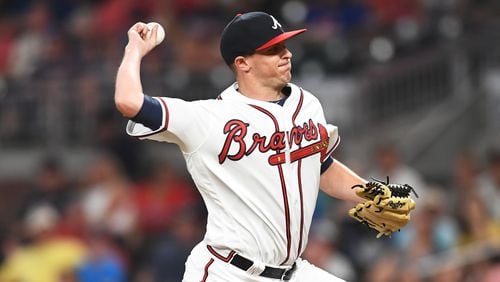Brad Brach  of the Atlanta Braves throws in eighth inning pitch against the Miami Marlins at SunTrust Park on July 30, 2018 in Atlanta, Georgia. (Photo by Scott Cunningham/Getty Images)