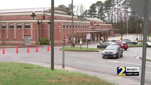 A Sandy Springs middle school physical education teacher resigned after he accidentally showed pornographic images on his personal computer to sixth graders.