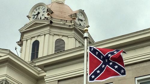 April 10, 2015: The Confederate battle flag flies outside the Chattooga County Courthouse in Summerville, Ga. The flag, which was flying on the 150th anniversary of the surrender of the Confederate forces at Appomatox, was put up with county approval by the local Sons of Confederate Veterans chapter. ROSALIND BENTLEY / rosalind.bentley@ajc.com