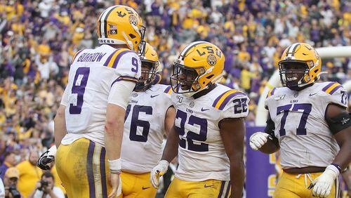Joe Burrow #9 of the LSU Tigers celebrates with teammates after rushing for a touchdown against the Auburn Tigers during the second half at Tiger Stadium on October 26, 2019 in Baton Rouge, Louisiana. (Photo by Chris Graythen/Getty Images)