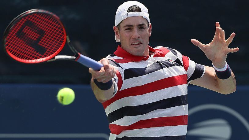 John Isner returns a forehand to Mischa Zverev of Germany during the BB&T Atlanta Open at Atlantic Station on July 27, 2018. (Photo by Kevin C. Cox/Getty Images)