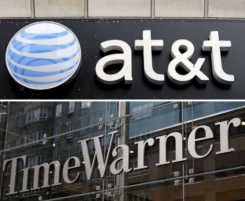 A combo file picture shows an AT&T store (top) in New York City, New York, USA, on 04 December 2008, and a view of the Time Warner Center (bottom) in New York City, New York, on Feb. 13, 2014.