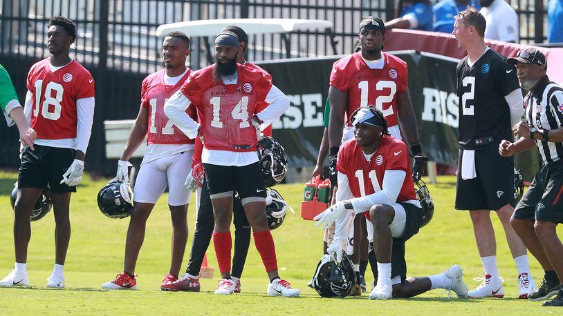 Receivers Calvin Ridley (from left), Marvin Hall, Justin Hardy, Mohamed Sanu and Julio Jones watch the action with quarterback Matt Ryan. Curtis Compton/ccompton@ajc.com
