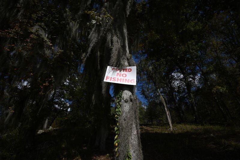 “No Fishing” sign is posted on the private property where fisherman can access to Yellow Jacket Shoals in the Flint River, Thursday, Oct. 19, 2023, in Upson County. (Hyosub Shin / Hyosub.Shin@ajc.com)