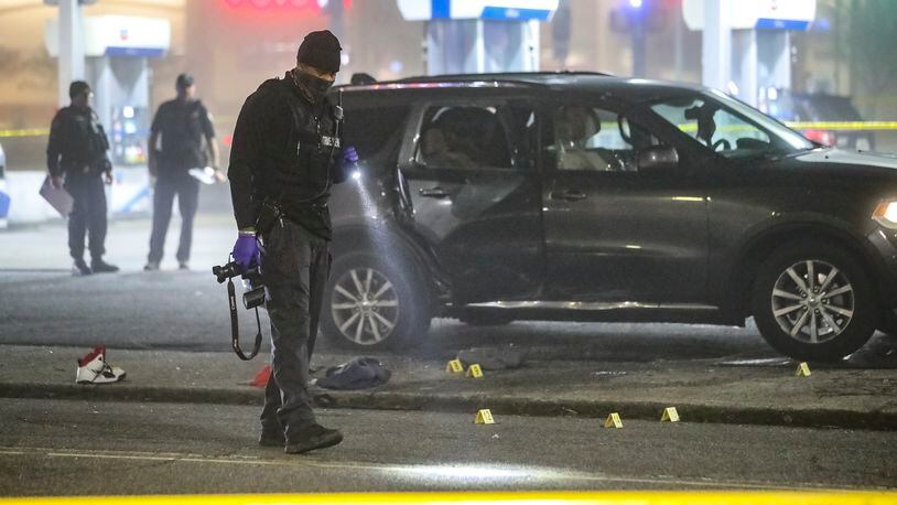 A man was rushed to a hospital in critical condition during the very early hours of Feb. 11, 2021, after he was shot outside a gas station in southwest Atlanta. He was one of two men shot inside an SUV at a Chevron on the corner of Martin Luther King Jr. Drive and Peyton Road, according to Atlanta police. (JOHN SPINK / John.Spink@ajc.com)