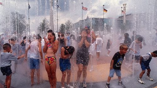 Among the many visitors cooling off in the rings fountain at Centennial Olympic Park Monday, July 22, 1996 during the 1996 Summer Olympic Games in Atlanta, Georgia are Kristin Campagna, 10, from Marietta, wearing her brightly colored two-piece swimsuit. Even though her family has tickets to an evening gymnastics performance, Kristin came wearing her swimsuit hoping for a chance to play in the fountain.
MANDATORY CREDIT: JEAN SHIFRIN / THE ATLANTA JOURNAL-CONSTITUTION
