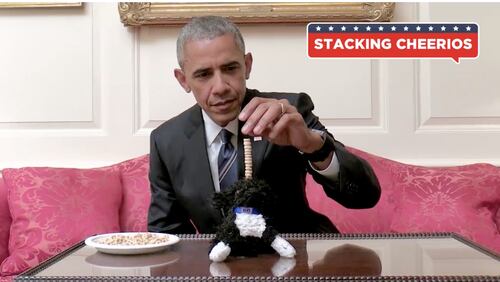 OK so this looks somewhat less than impossible, but that's because POTUS is stacking Cheerios on little stuffed Bo, not an actual baby.