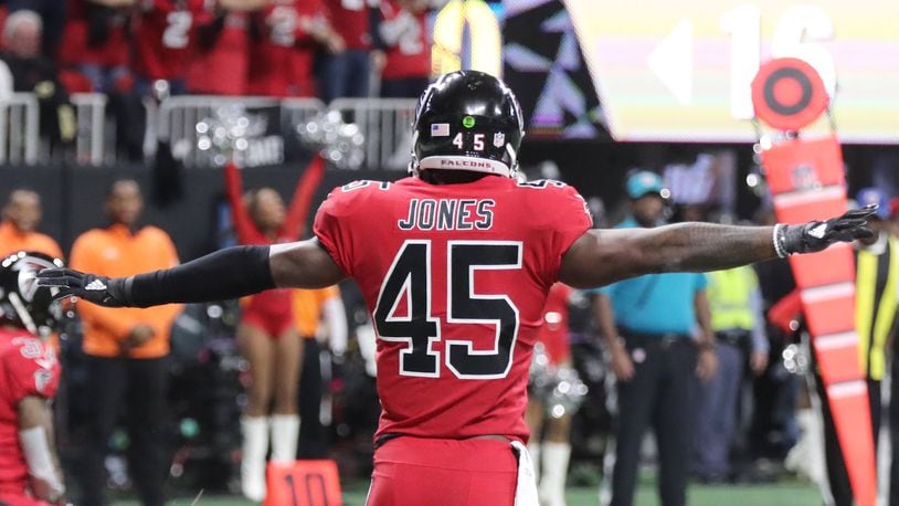 Atlanta Falcons middle linebacker Deion Jones (45) signals no catch after the Falcons held the Saints to a field goal on their first possession against the New Orleans Saints at Mercedes-Benz Stadium in Atlanta.